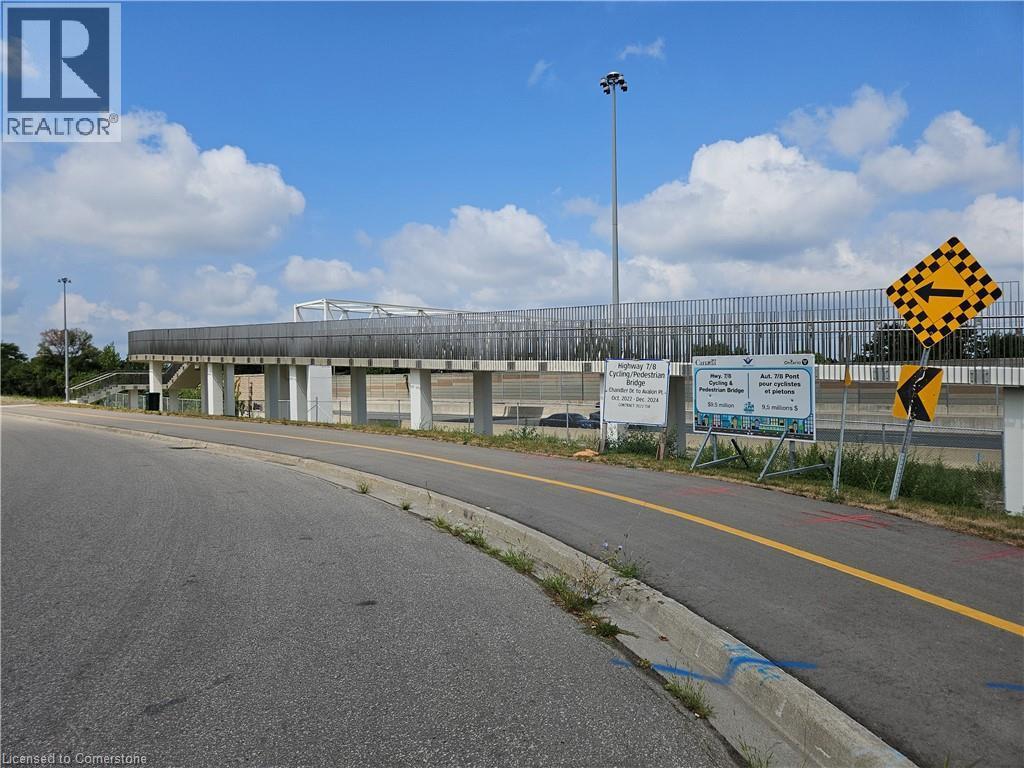 other side of foot bridge that comes out near grocery store and restaraunts - 4 Avalon Place Unit# 102, Kitchener, ON - Outdoor With View