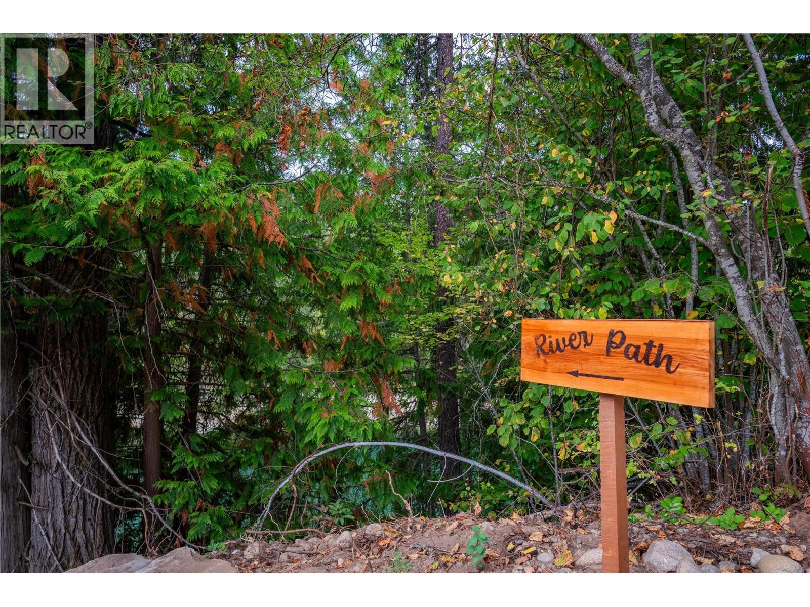 Sign that leads you to the rivers path. - 2697 Osachoff Road, South Slocan, BC - Outdoor
