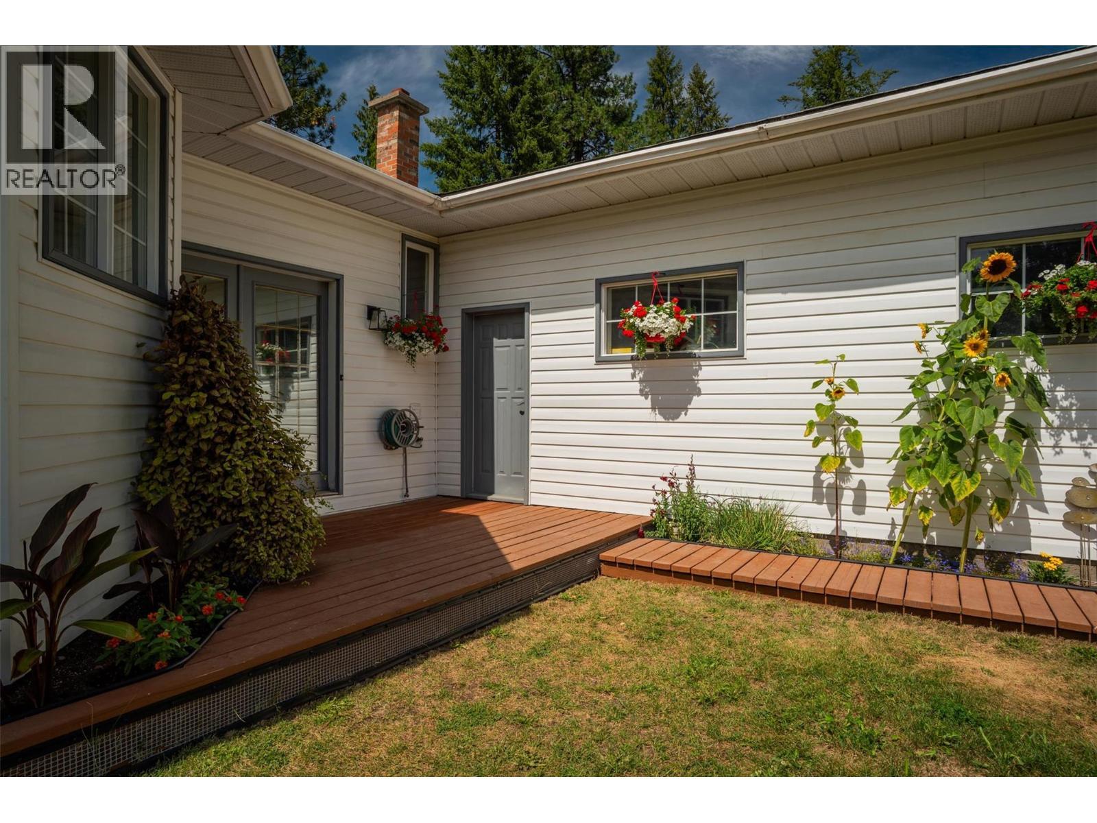 Main house that overlooks the river. - 2697 Osachoff Road, South Slocan, BC - Outdoor With Exterior