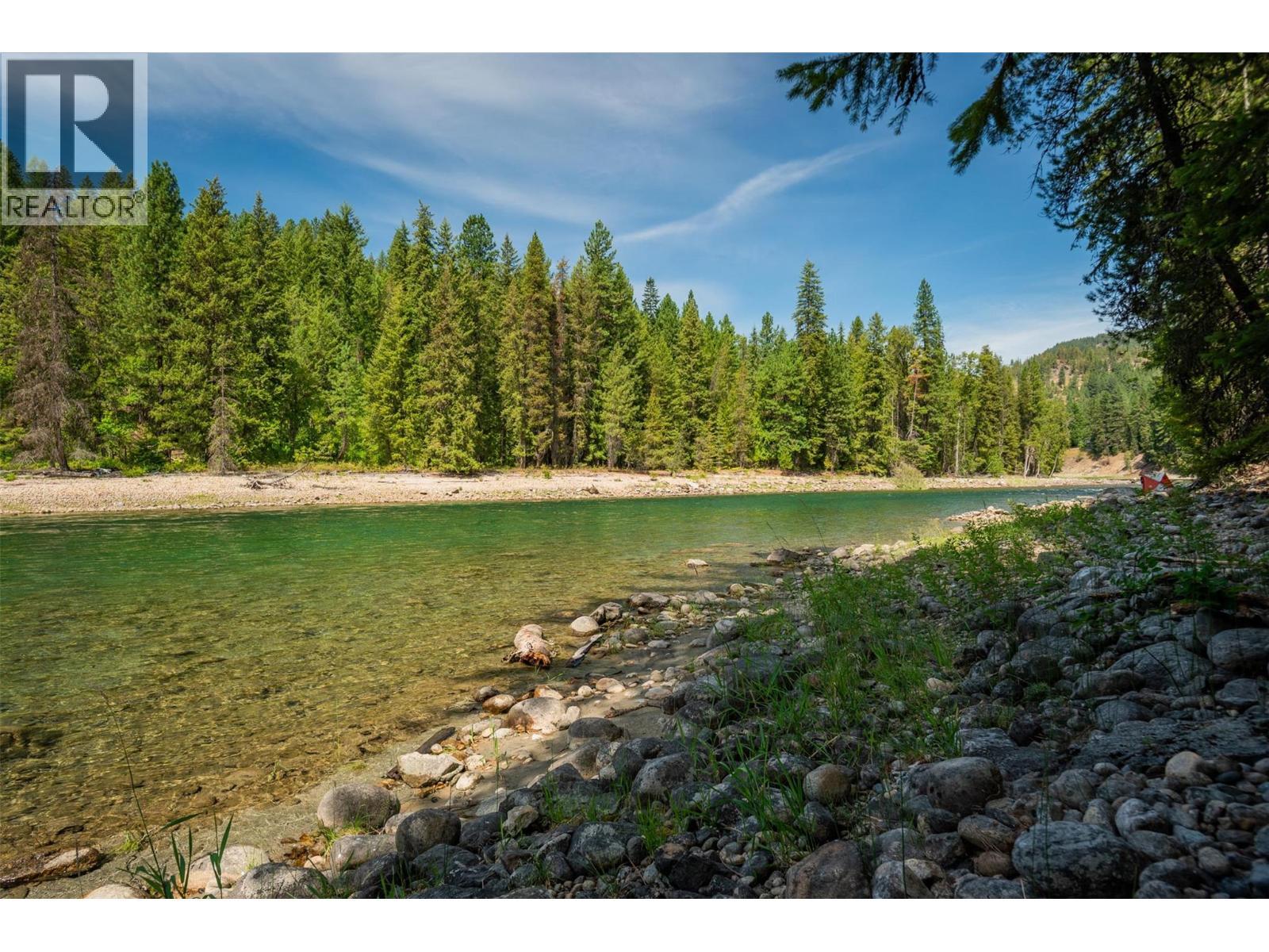 A gorgeous sunny beach with the perfect swimming spot. - 2697 Osachoff Road, South Slocan, BC - Outdoor With View