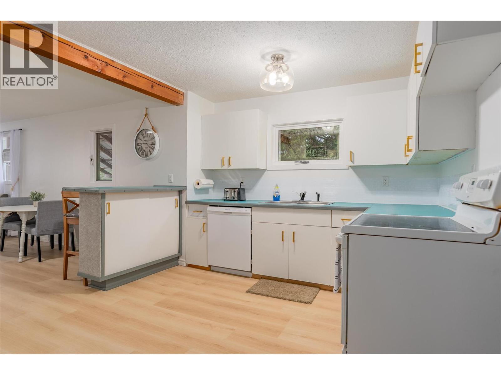 Kitchen of the small house. - 2697 Osachoff Road, South Slocan, BC - Indoor Photo Showing Laundry Room