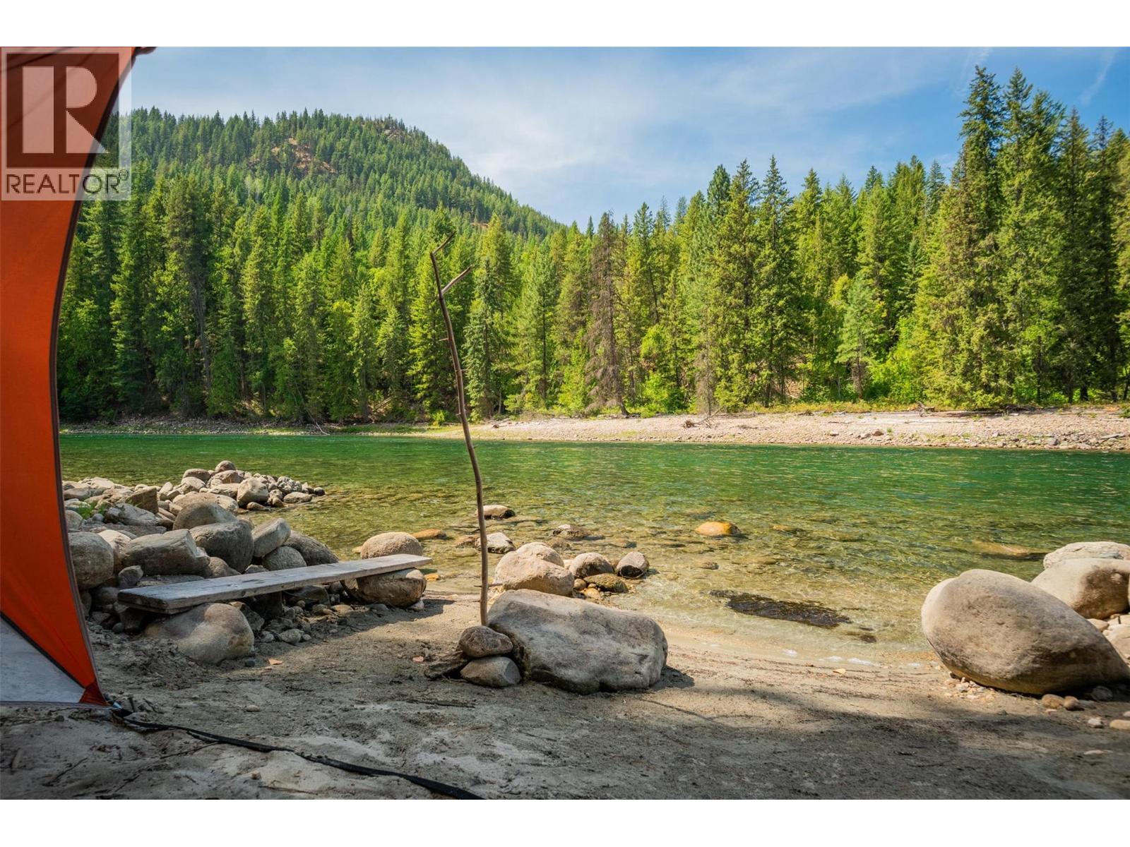 A gorgeous sunny beach with the perfect swimming spot. - 2697 Osachoff Road, South Slocan, BC - Outdoor With View