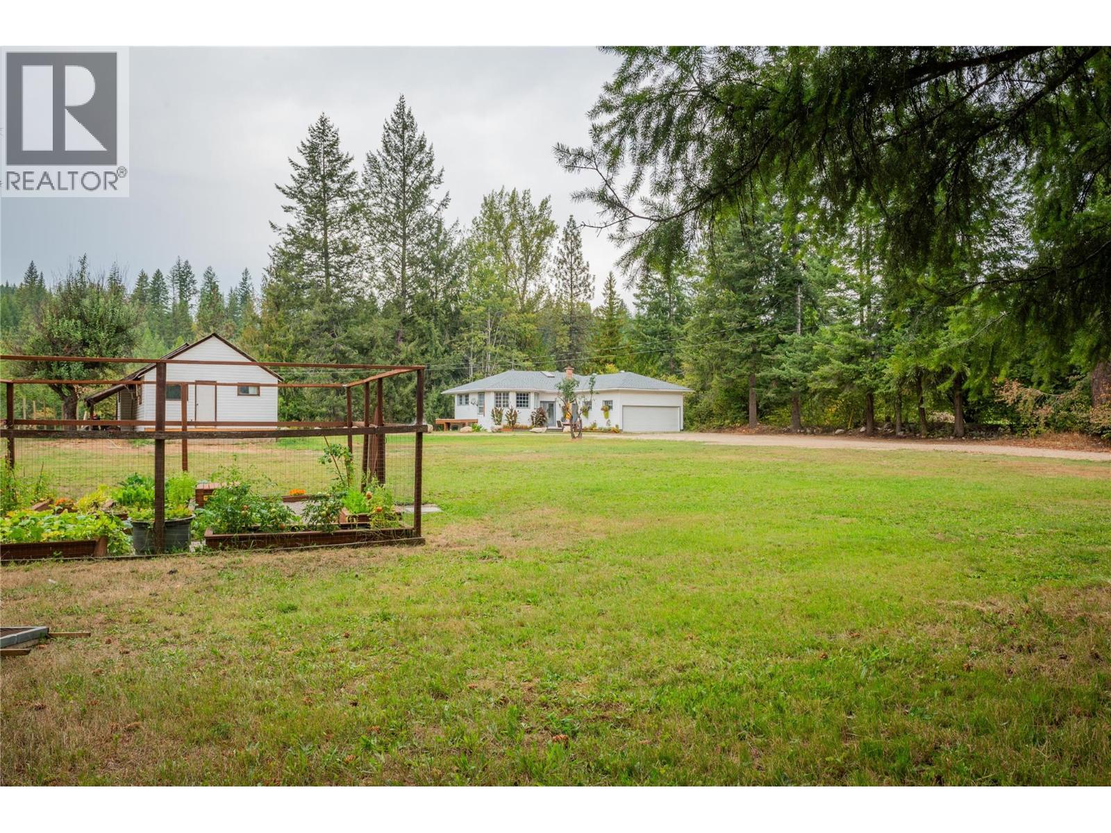 Front yard of the small house and main house. - 2697 Osachoff Road, South Slocan, BC - Outdoor