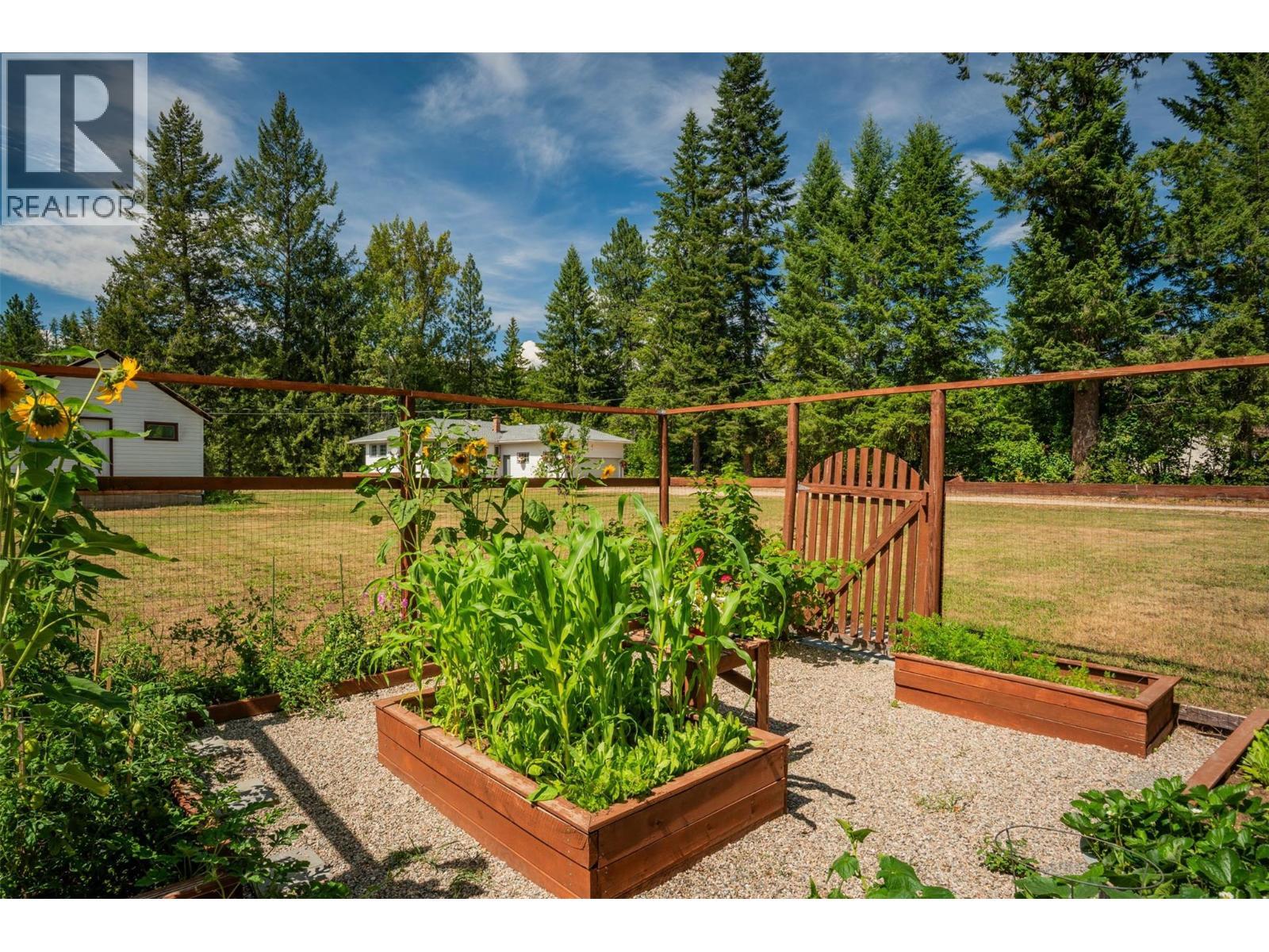 Beautiful fenced garden with raised bed. - 2697 Osachoff Road, South Slocan, BC - Outdoor