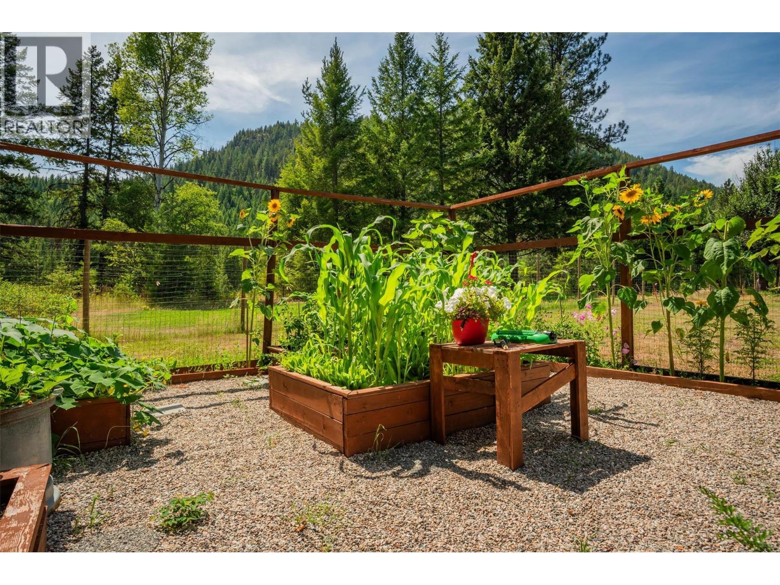 Beautiful fenced garden with raised bed. - 2697 Osachoff Road, South Slocan, BC - Outdoor