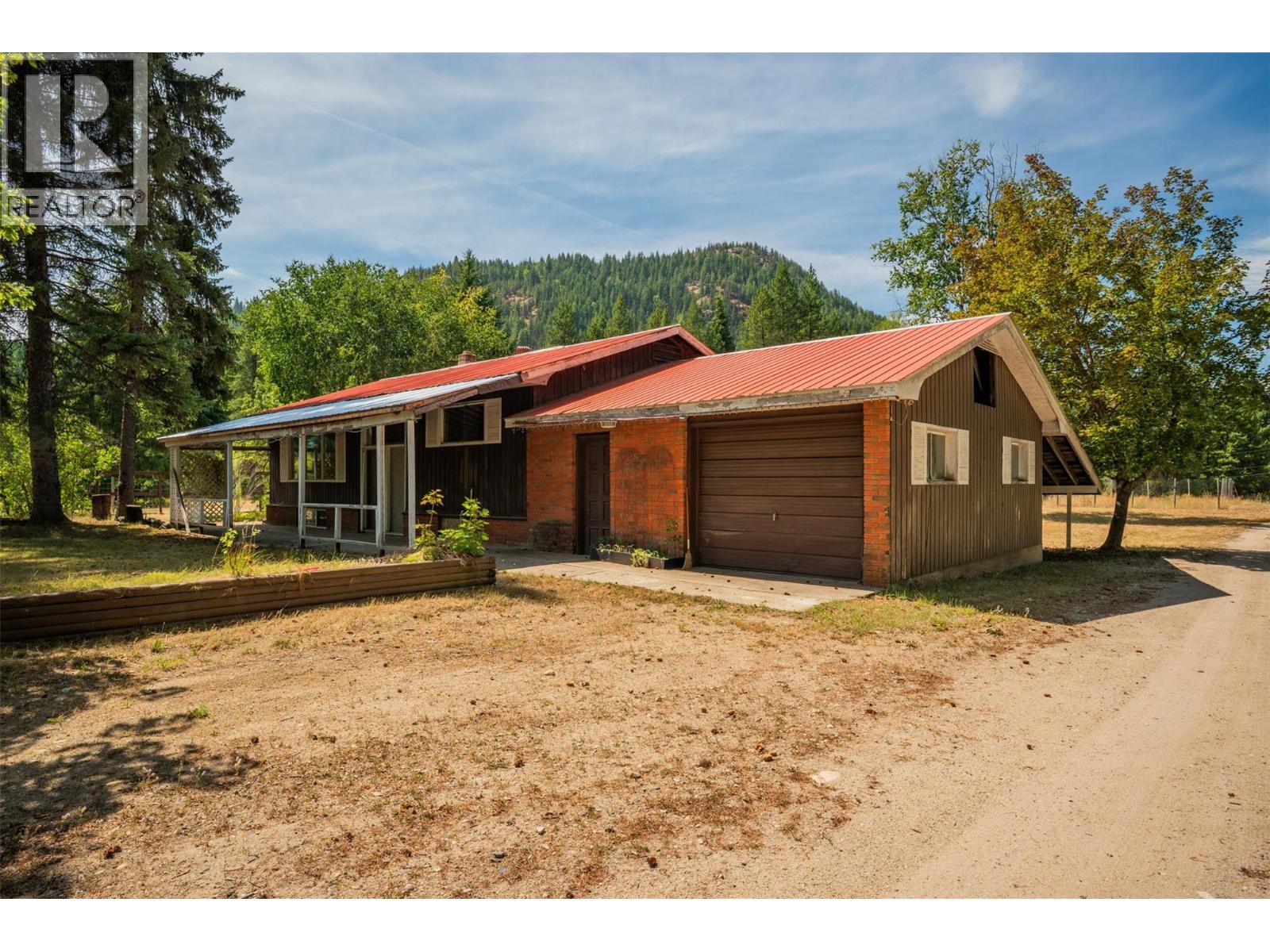 Front of the brown house. - 2697 Osachoff Road, South Slocan, BC - Outdoor