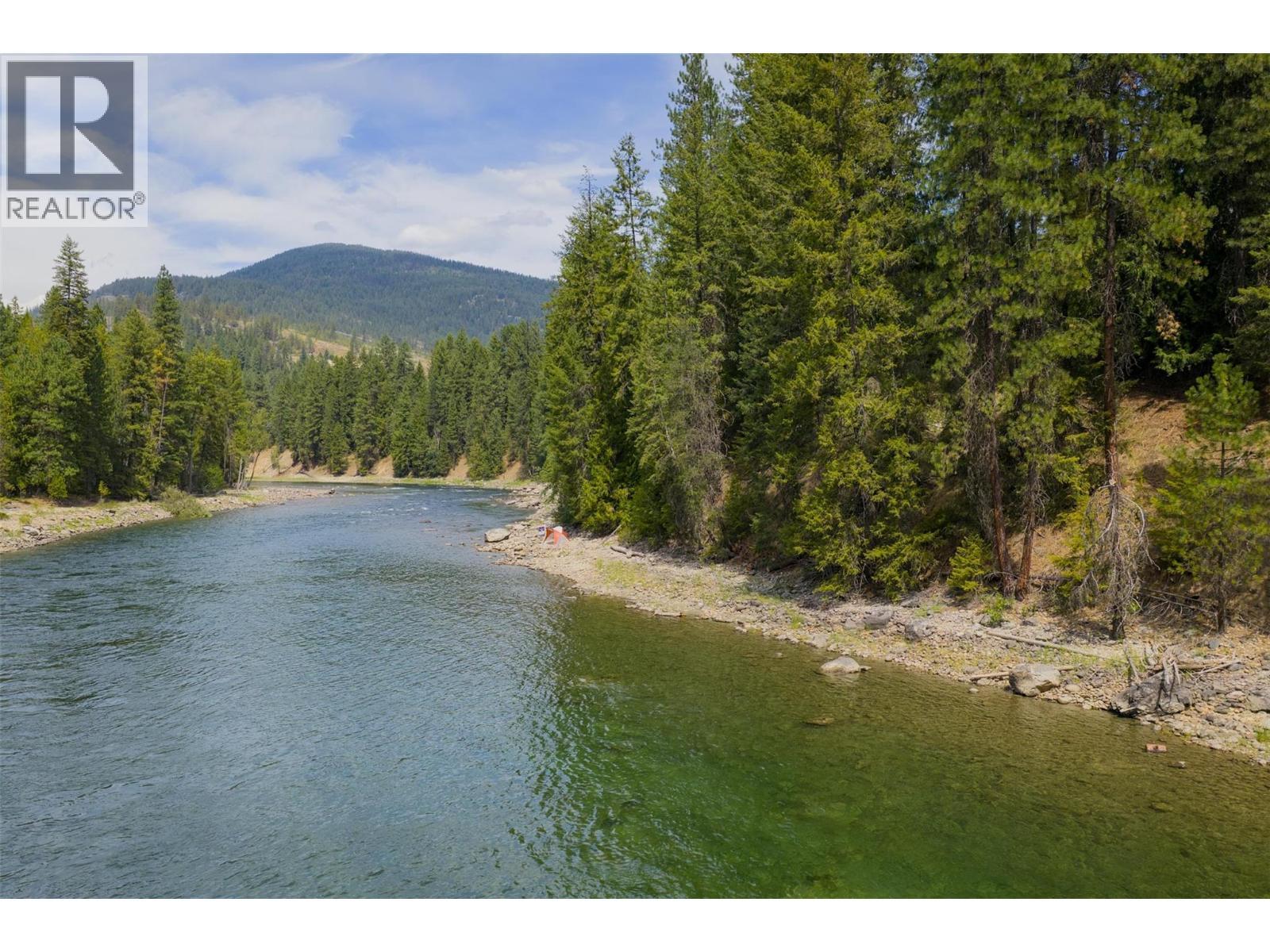 151 feet of river frontage on the iconic Slocan River. - 2697 Osachoff Road, South Slocan, BC - Outdoor With Body Of Water With View