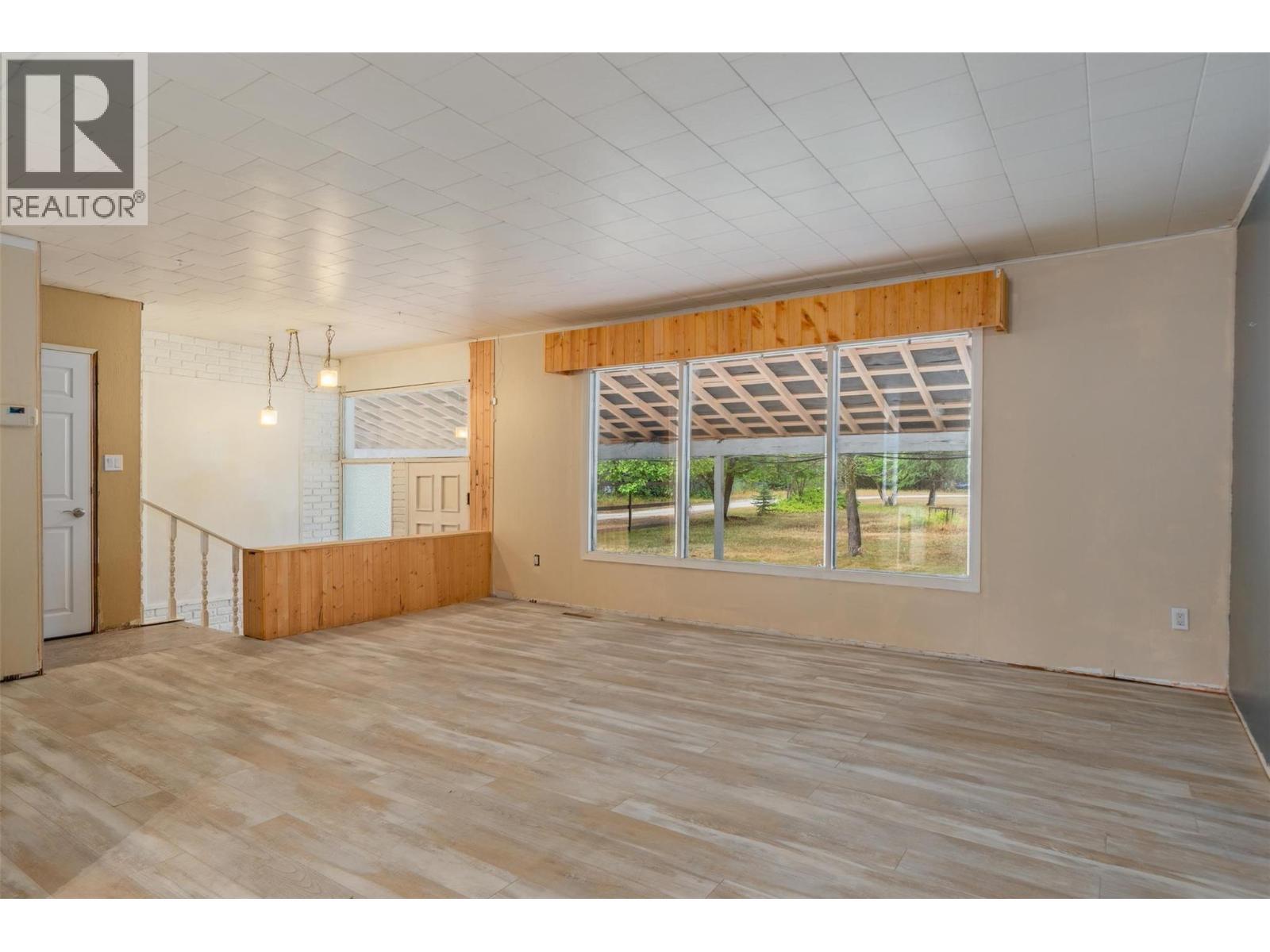 Livingroom of the brown house. - 2697 Osachoff Road, South Slocan, BC - Indoor Photo Showing Other Room