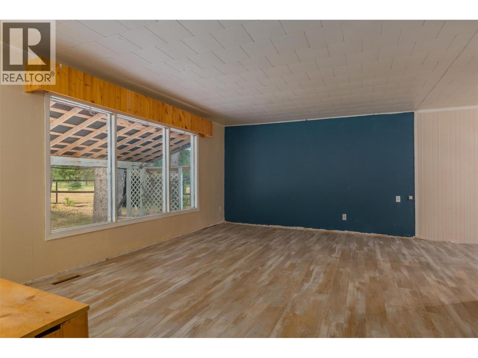 Livingroom of the brown house. - 2697 Osachoff Road, South Slocan, BC - Indoor Photo Showing Other Room