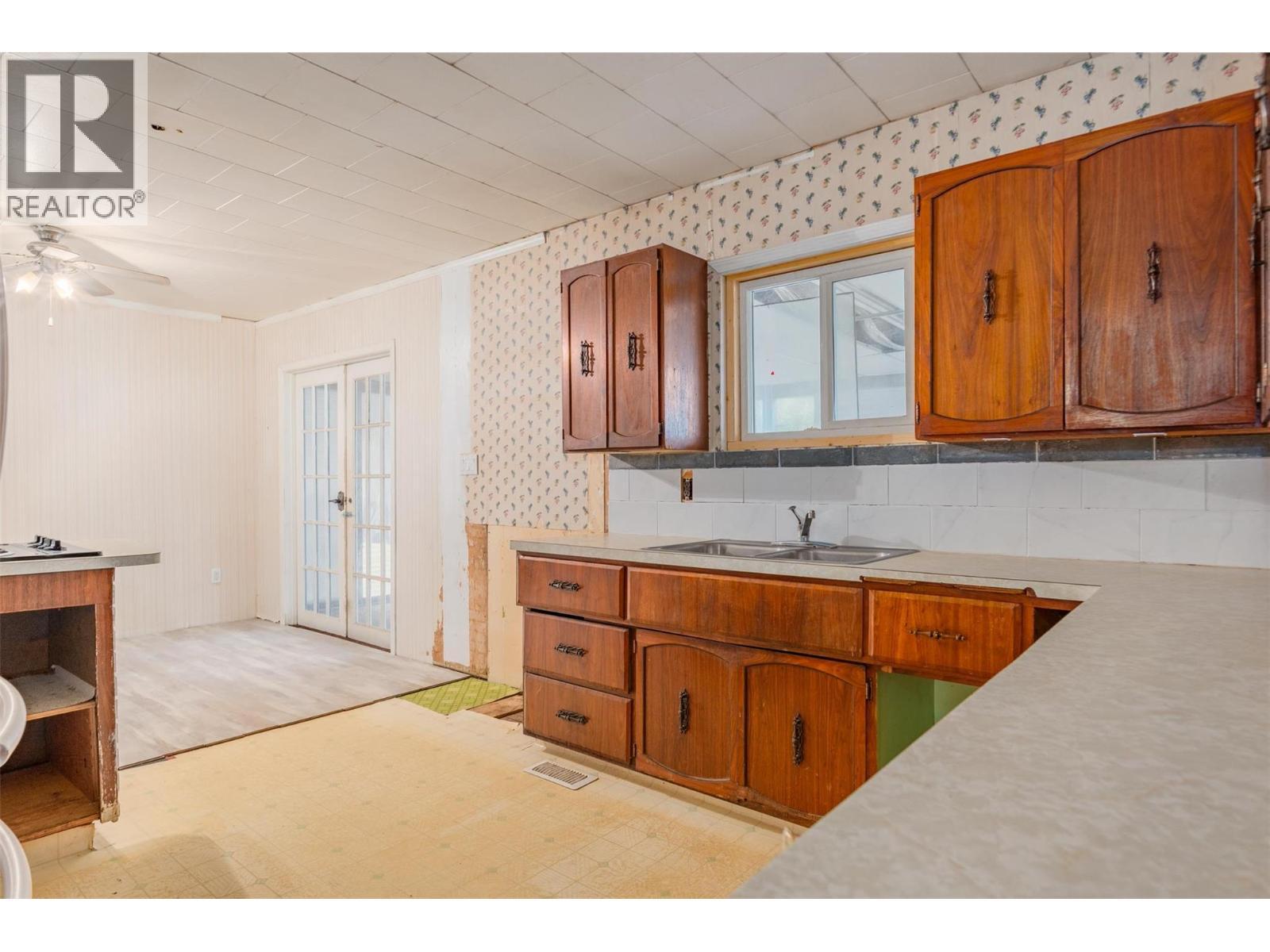 Kitchen of the brown house. - 2697 Osachoff Road, South Slocan, BC - Indoor