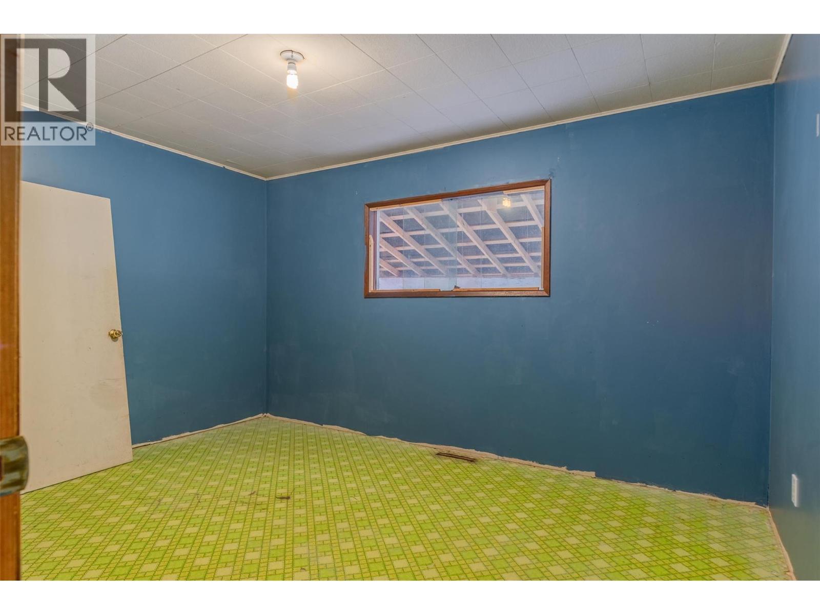 Bedroom in the brown house. - 2697 Osachoff Road, South Slocan, BC - Indoor