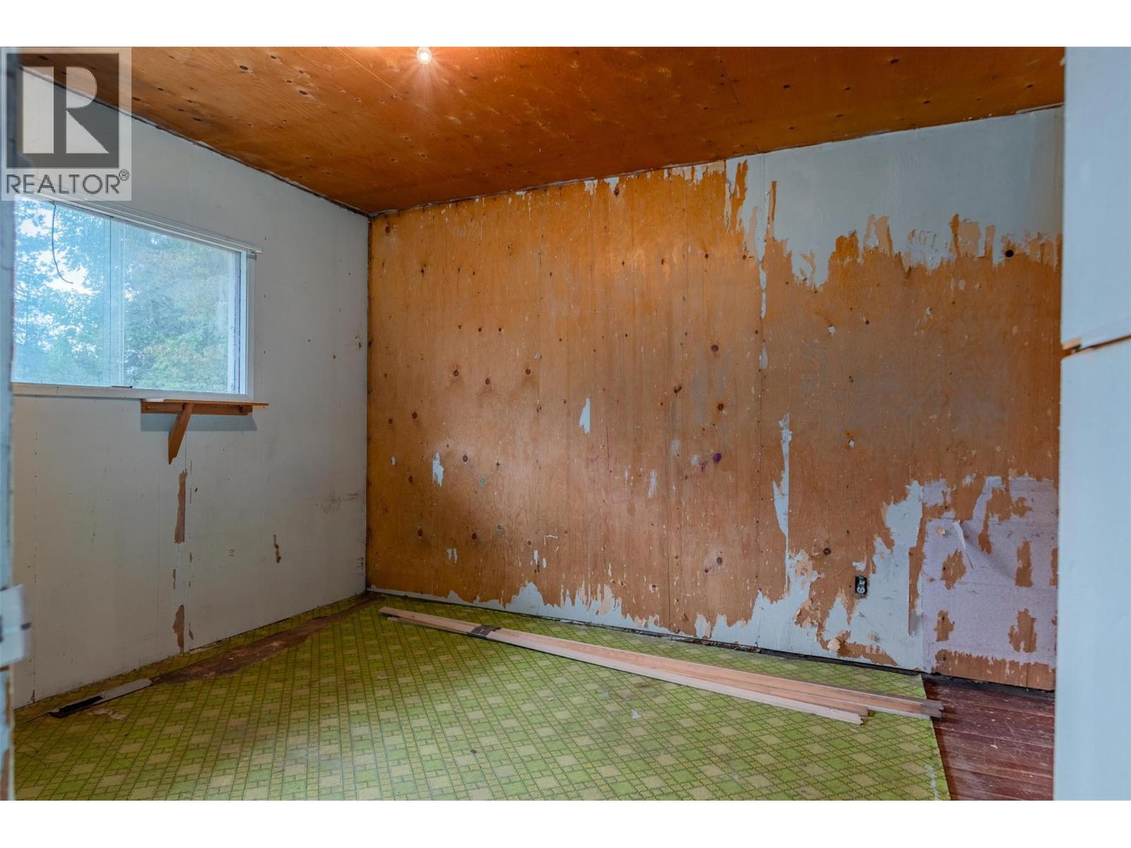 Bedroom in the brown house. - 2697 Osachoff Road, South Slocan, BC - Indoor Photo Showing Other Room