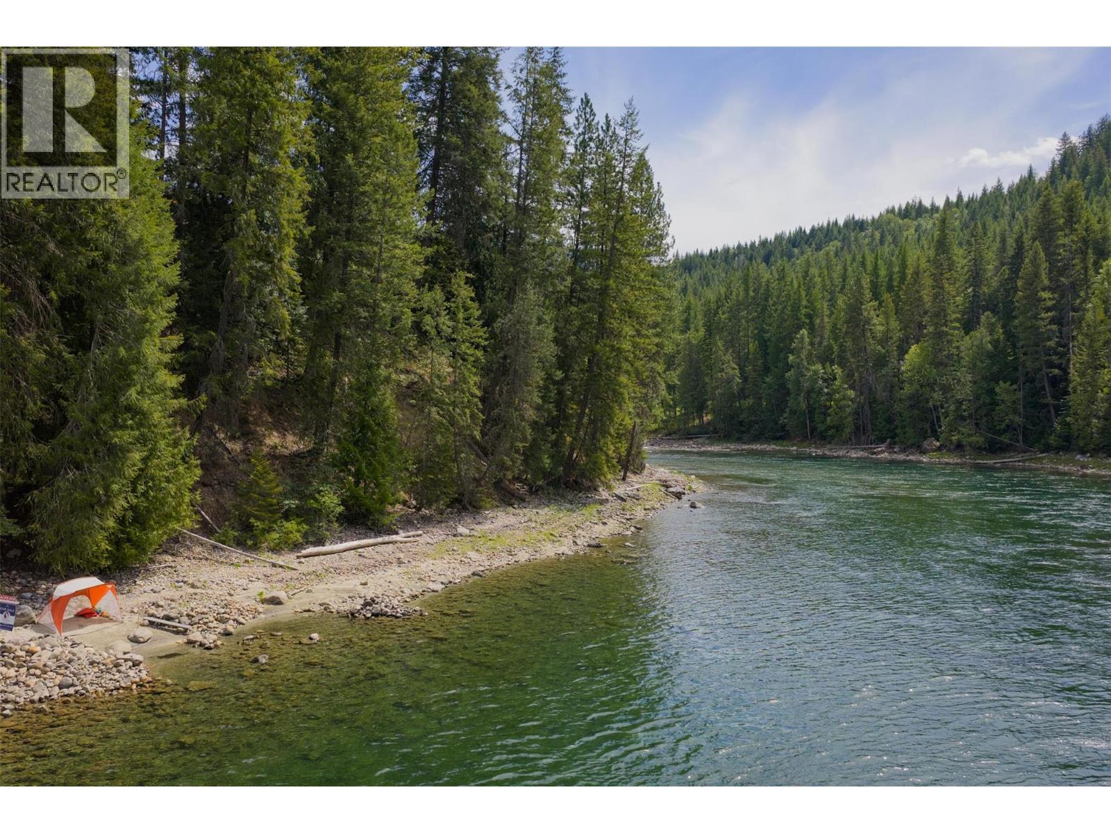 151 feet of river frontage on the iconic Slocan River. - 2697 Osachoff Road, South Slocan, BC - Outdoor With Body Of Water With View