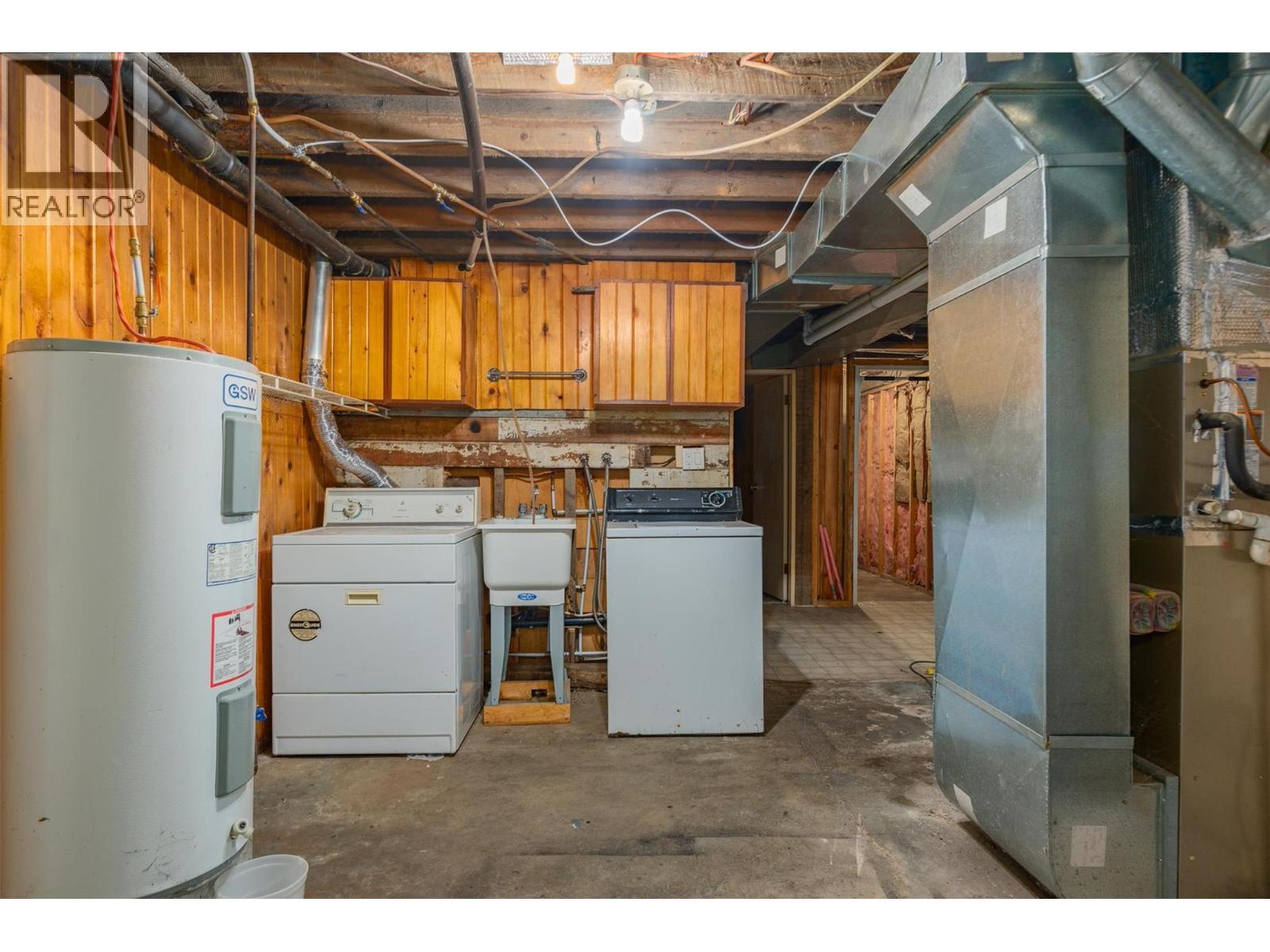 Unfinished basement of the brown house. - 2697 Osachoff Road, South Slocan, BC - Indoor Photo Showing Basement