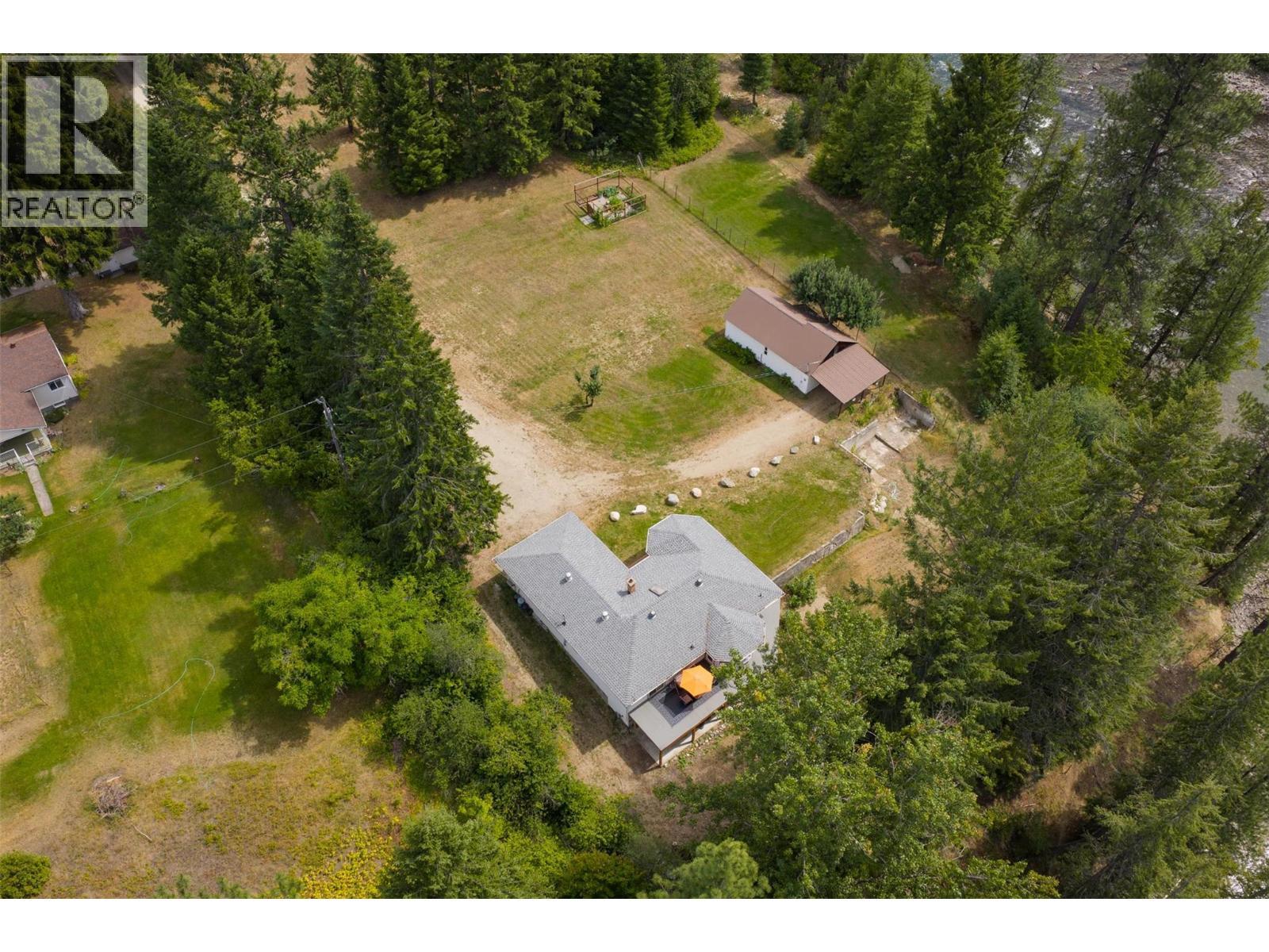 Main house and small house that overlook the river. - 2697 Osachoff Road, South Slocan, BC - Outdoor With View