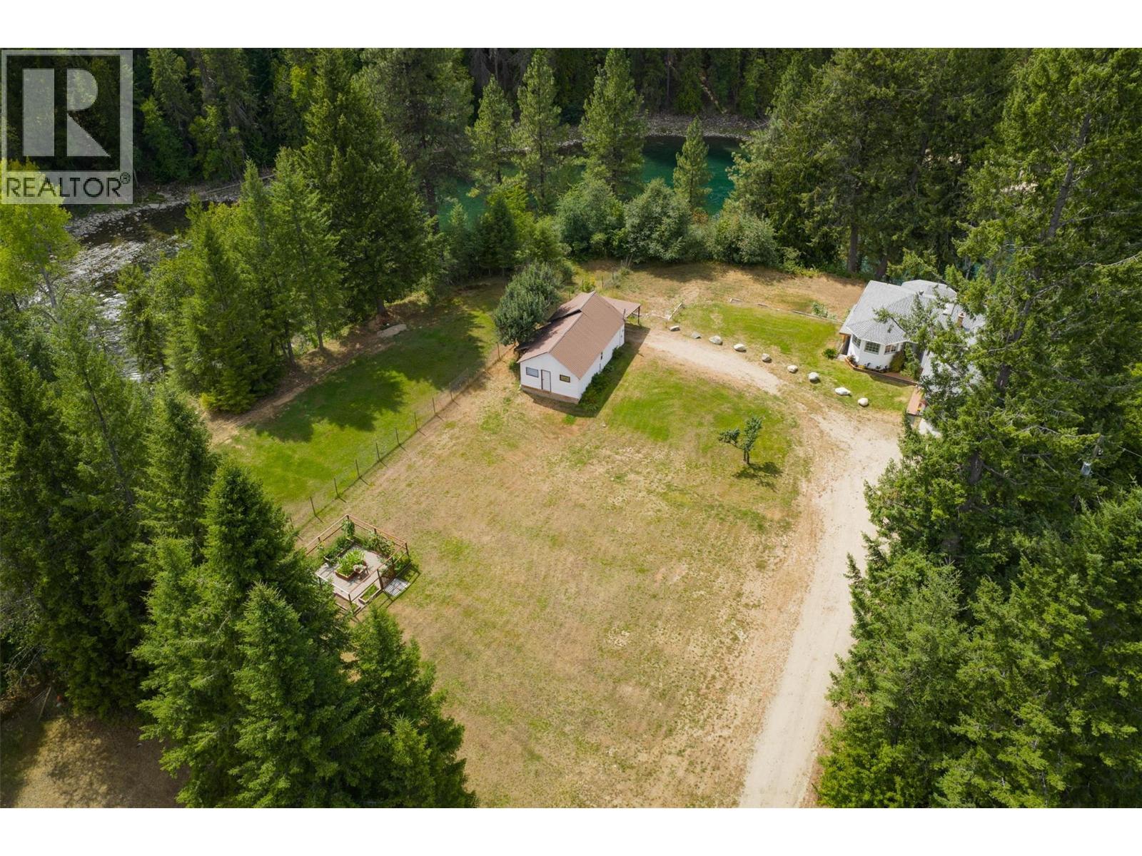 Main house and small house that overlook the river. - 2697 Osachoff Road, South Slocan, BC - Outdoor With View