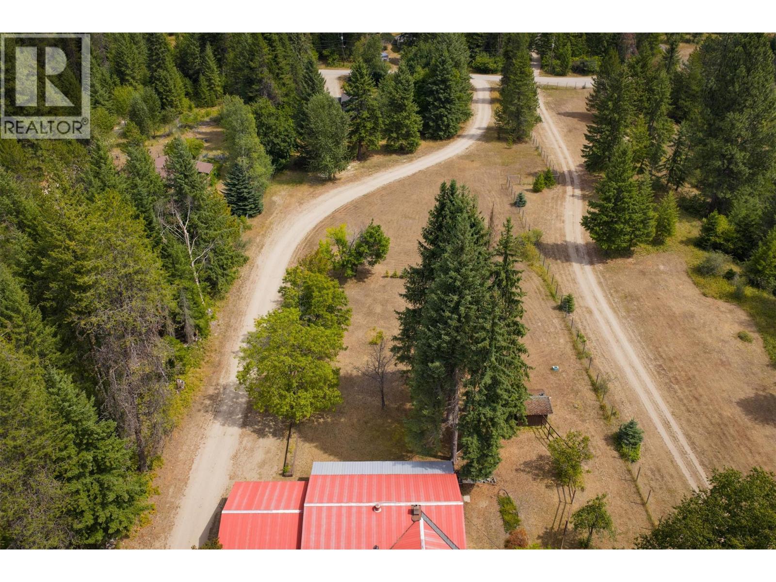 Acreage between the main house and the brown house. - 2697 Osachoff Road, South Slocan, BC - Outdoor With View