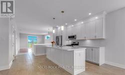 Looking from dining area to kitchen/living area -