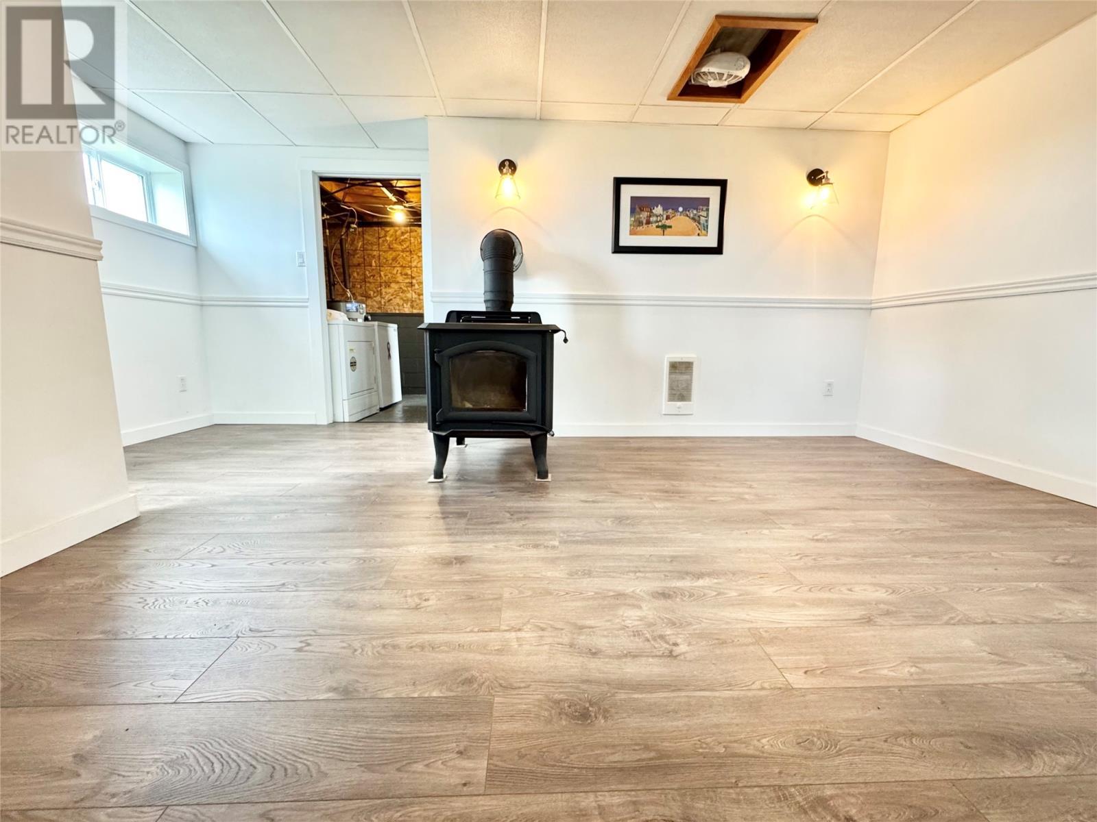 7 Dyke'S Lane, Musgrave Harbour, NL - Indoor Photo Showing Other Room With Fireplace