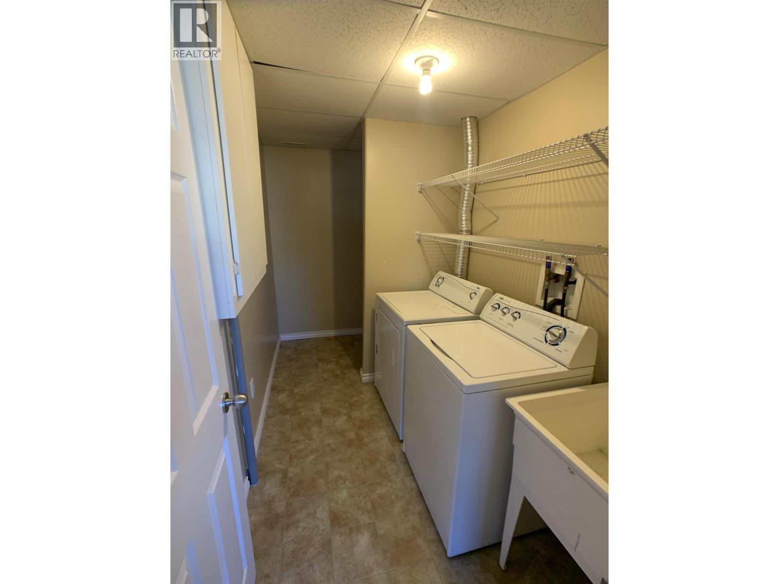 B 4609 Boundary Road, Fort Nelson, BC - Indoor Photo Showing Laundry Room