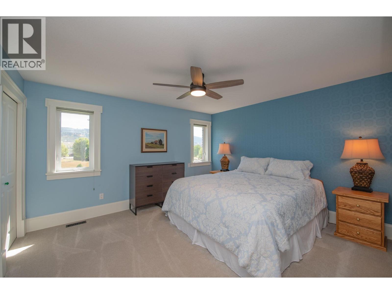 Bedroom with private ensuite - 8163 Old Kamloops Road, Vernon, BC - Indoor Photo Showing Bedroom