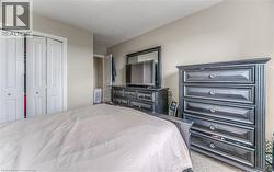 Bedroom featuring carpet floors and a closet -