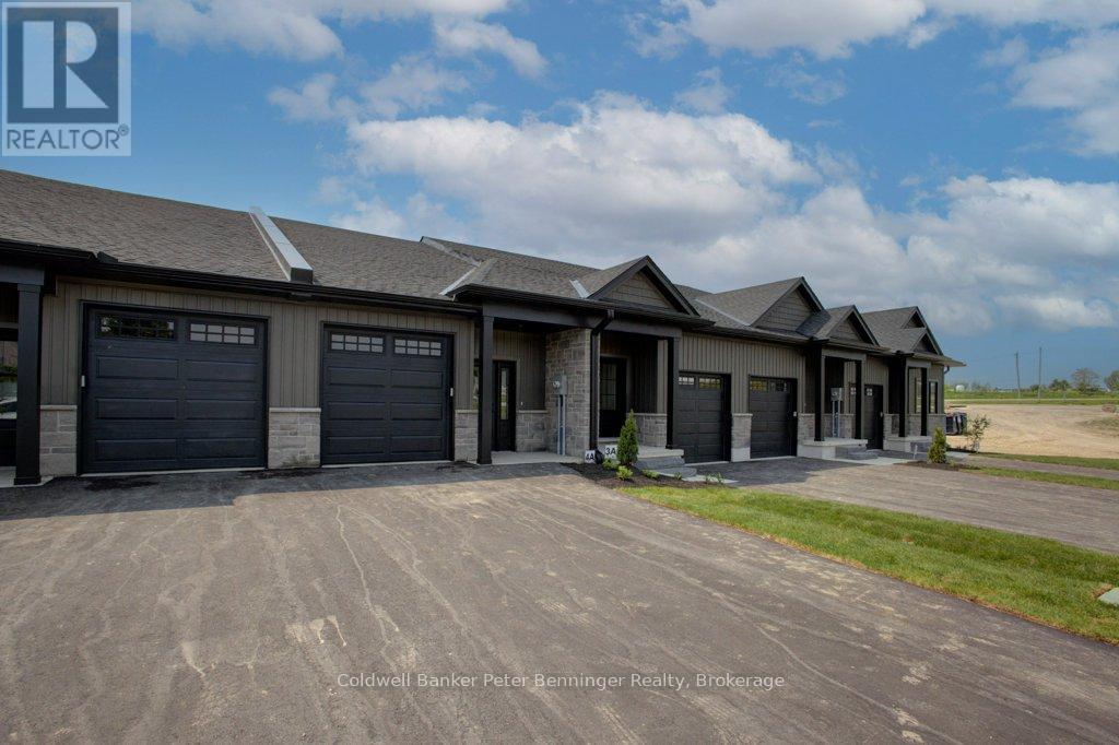 Covered front entries. - 2 - 305 Arnaud Street, Arran-Elderslie, ON - Outdoor With Facade