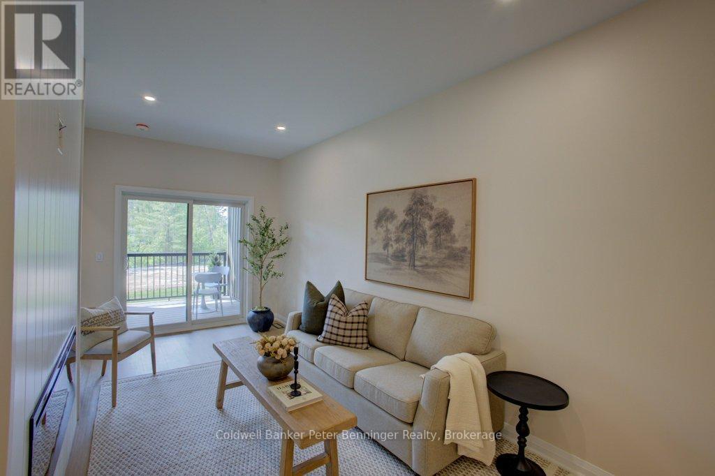 Livingroom with deck (pic from staged unit 4) - 2 - 305 Arnaud Street, Arran-Elderslie, ON - Indoor Photo Showing Living Room
