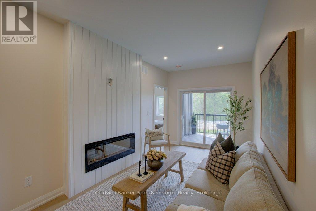 Lovely fireplace (pic from staged unit 4) - 2 - 305 Arnaud Street, Arran-Elderslie, ON - Indoor Photo Showing Living Room With Fireplace