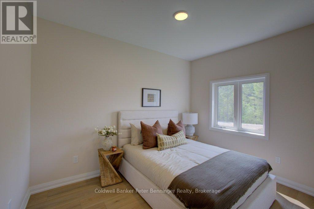 Main bedroom with Q Bed (pic from staged unit 4) - 2 - 305 Arnaud Street, Arran-Elderslie, ON - Indoor Photo Showing Bedroom