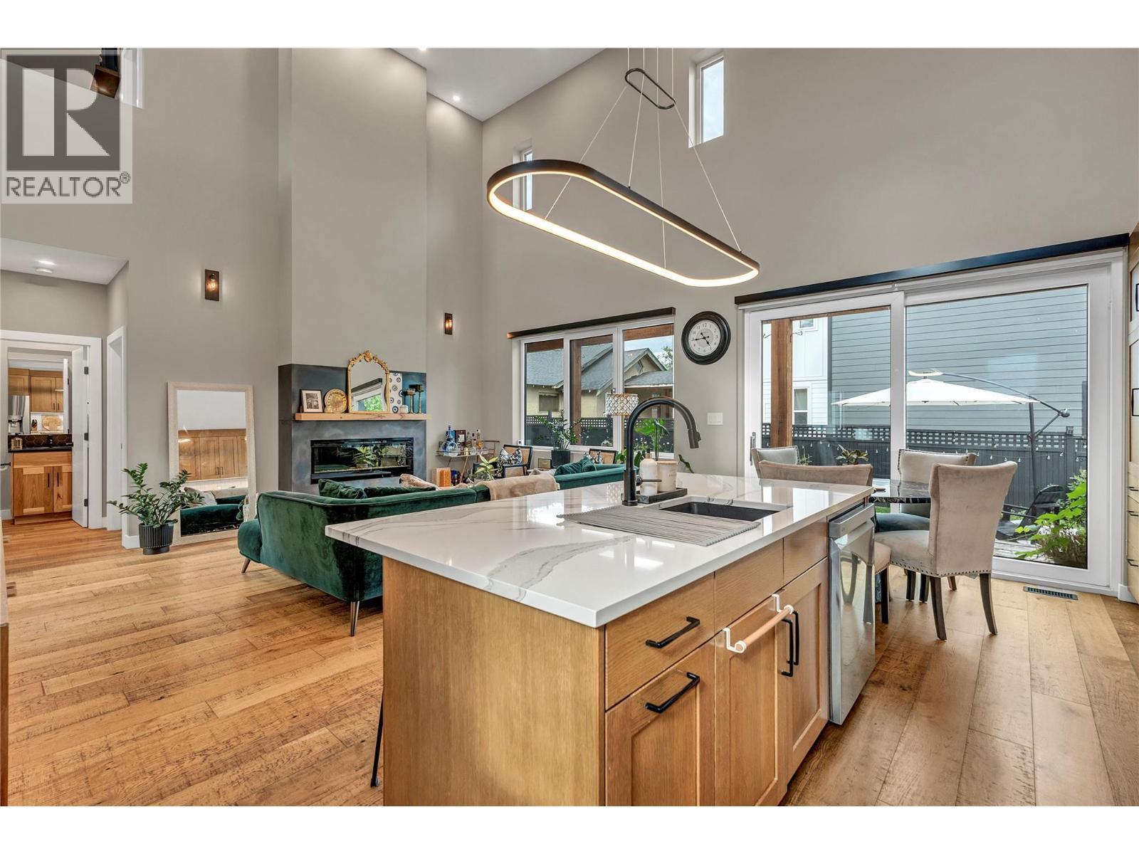 1695 Treffry Place, Summerland, BC - Indoor Photo Showing Kitchen With Fireplace