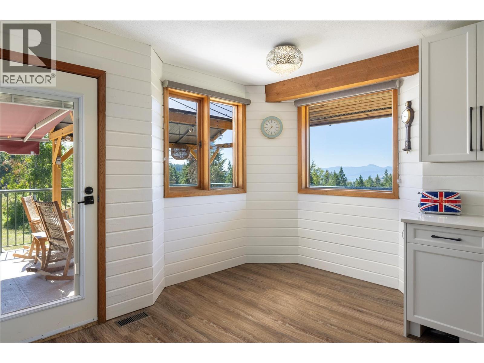 Kitchen Nook with Access to Deck - 7940 Keddleston Road, Vernon, BC