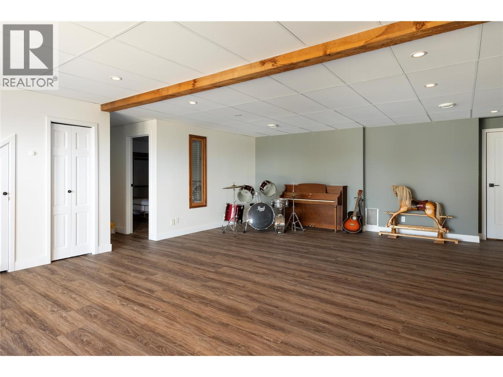 Lower Level - Recreation Area or Second Living Room Walkout - 7940 Keddleston Road, Vernon, BC - Indoor Photo Showing Other Room