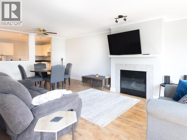 202-4685 Joyce Ave, Powell River, BC - Indoor Photo Showing Living Room With Fireplace