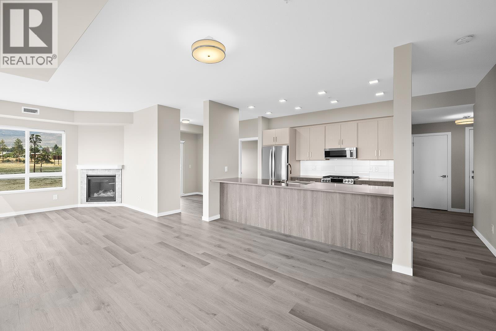 2301 Carrington Road Unit# 219, West Kelowna, BC - Indoor Photo Showing Other Room With Fireplace