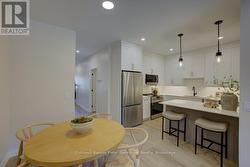 Dining Room to Kitchen (pic from staged unit 4) -