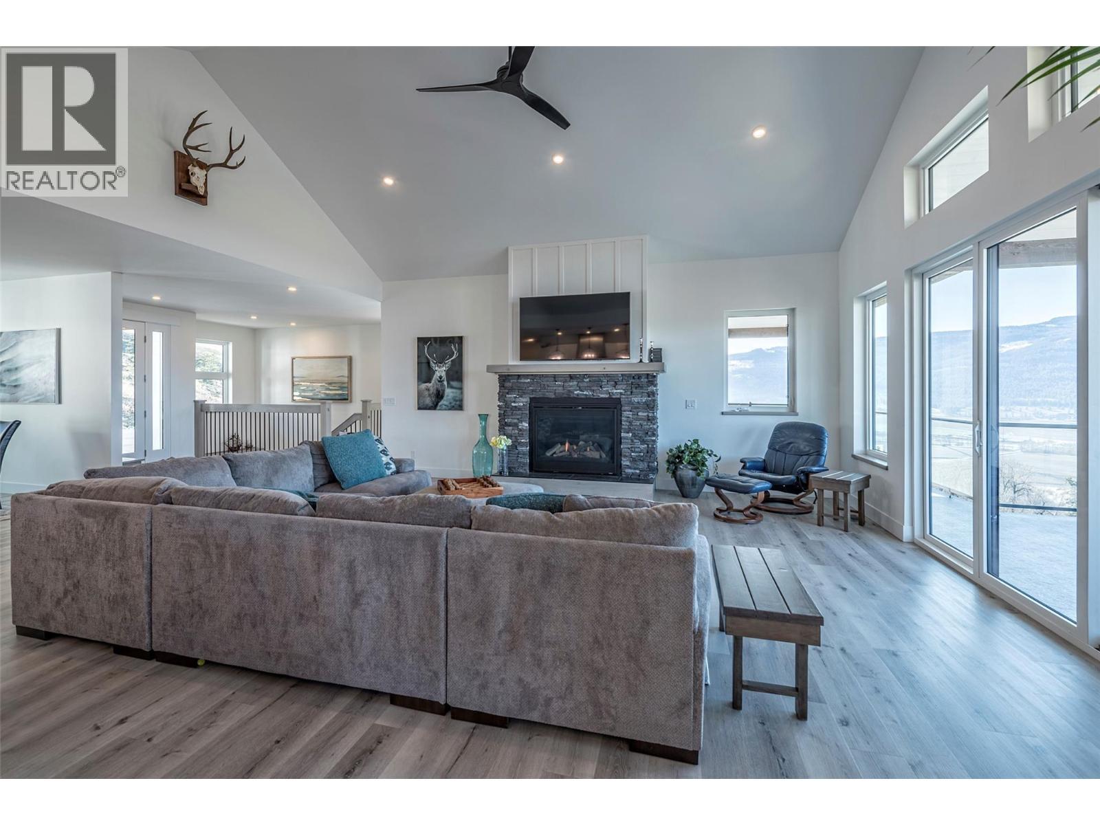 123 Ranchland Place, Coldstream, BC - Indoor Photo Showing Living Room With Fireplace