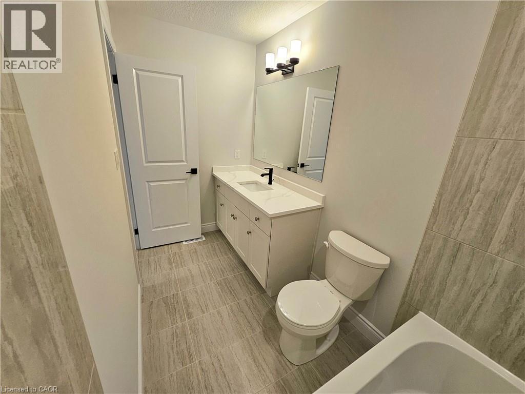 Photos of a previously completed unit - 15 Anne Street W, Harriston, ON - Indoor Photo Showing Bathroom
