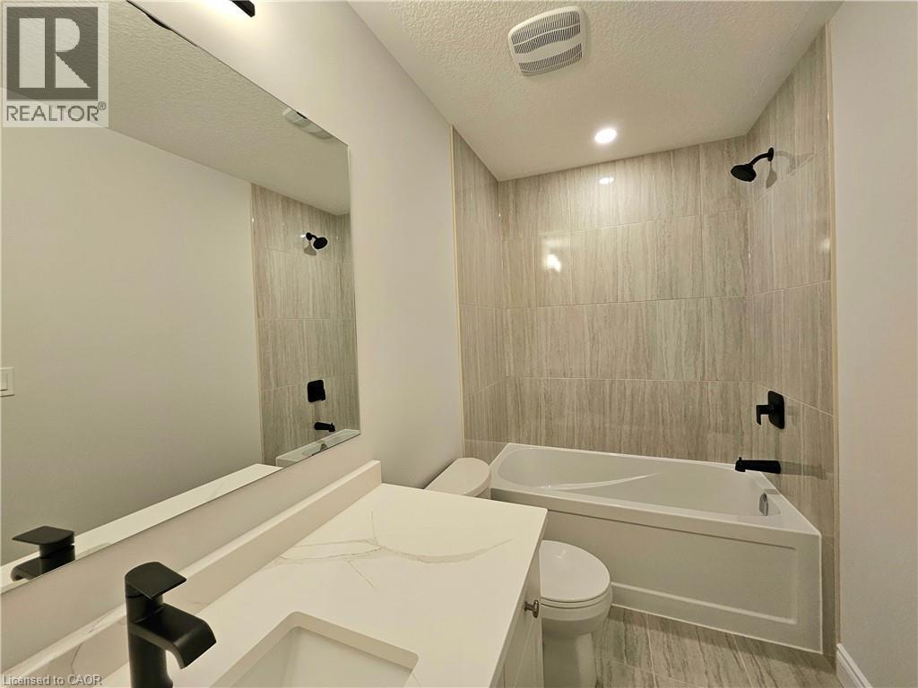 Photos of a previously completed unit - 15 Anne Street W, Harriston, ON - Indoor Photo Showing Bathroom