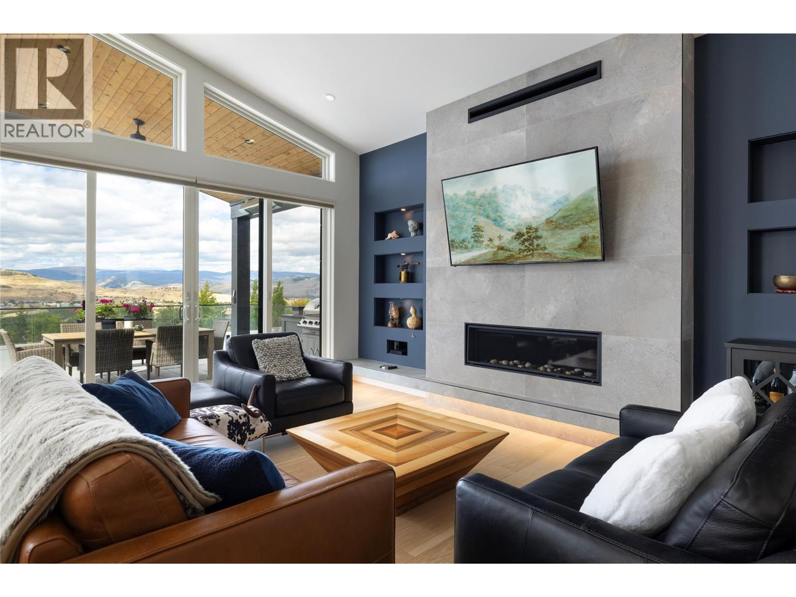 640 Mt. Ida Crescent, Coldstream, BC - Indoor Photo Showing Living Room With Fireplace