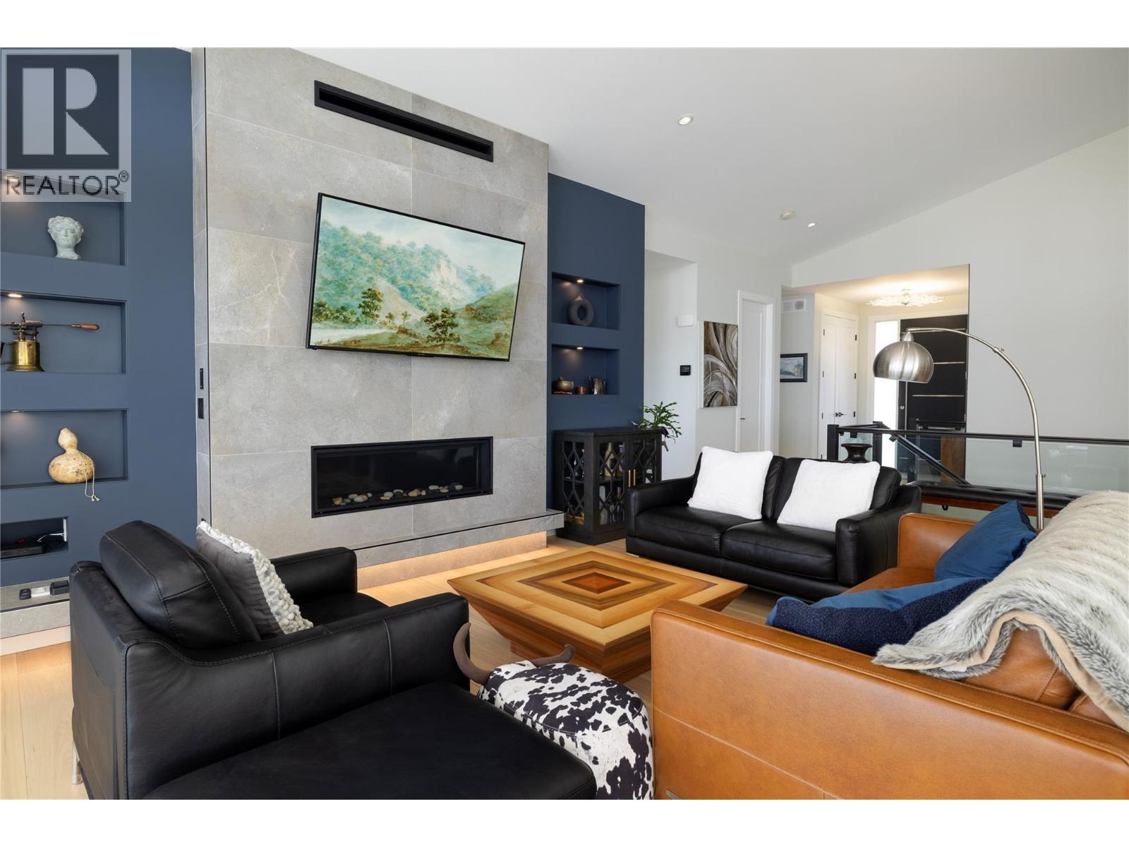 640 Mt. Ida Crescent, Coldstream, BC - Indoor Photo Showing Living Room With Fireplace
