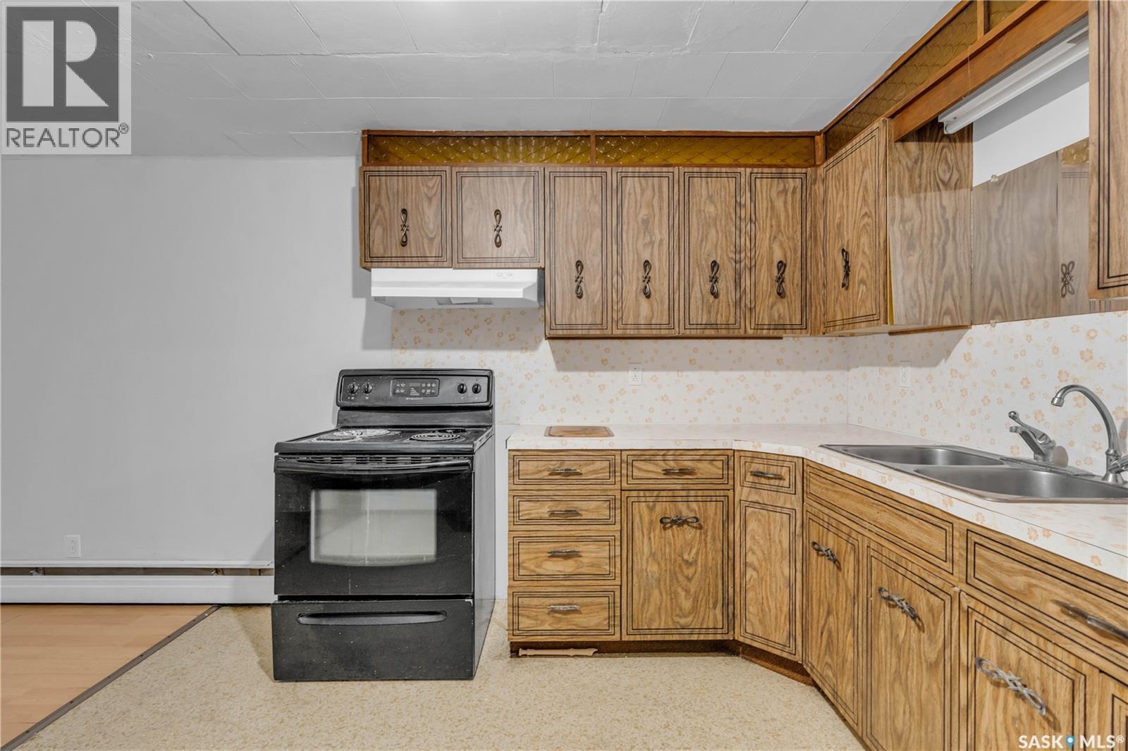 208 Lorne Street, Cupar, SK - Indoor Photo Showing Kitchen With Double Sink