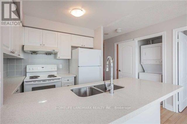 1404 - 50 Brian Harrison Way, Toronto, ON - Indoor Photo Showing Kitchen With Double Sink