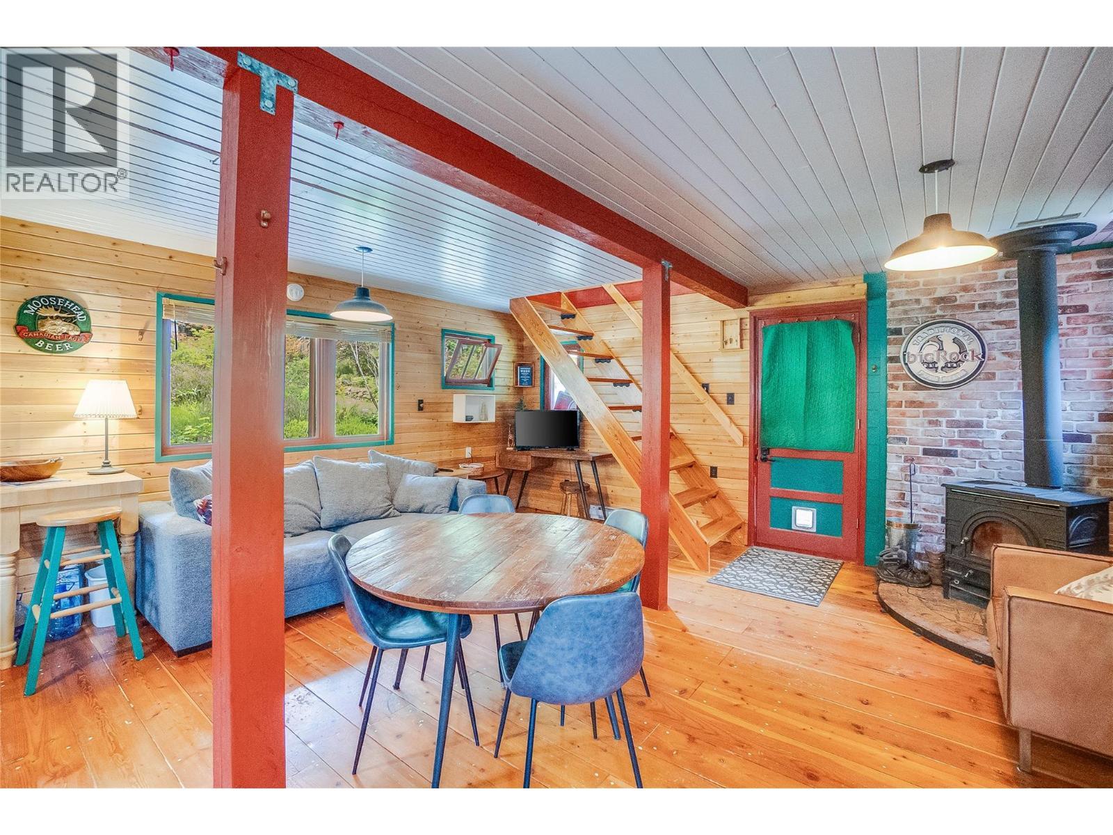 8780 Martens Road, Slocan, BC - Indoor Photo Showing Dining Room With Fireplace