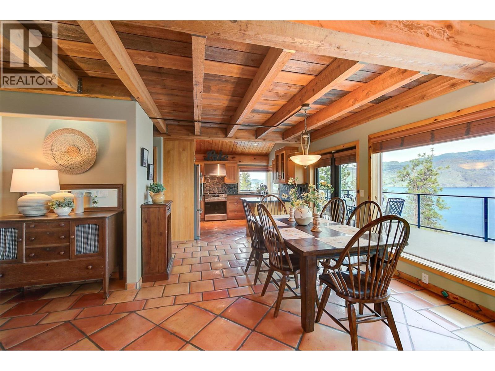 Panoramic views of Okanagan Lake and Mountains - 7172 Brent Road, Peachland, BC - Indoor Photo Showing Dining Room