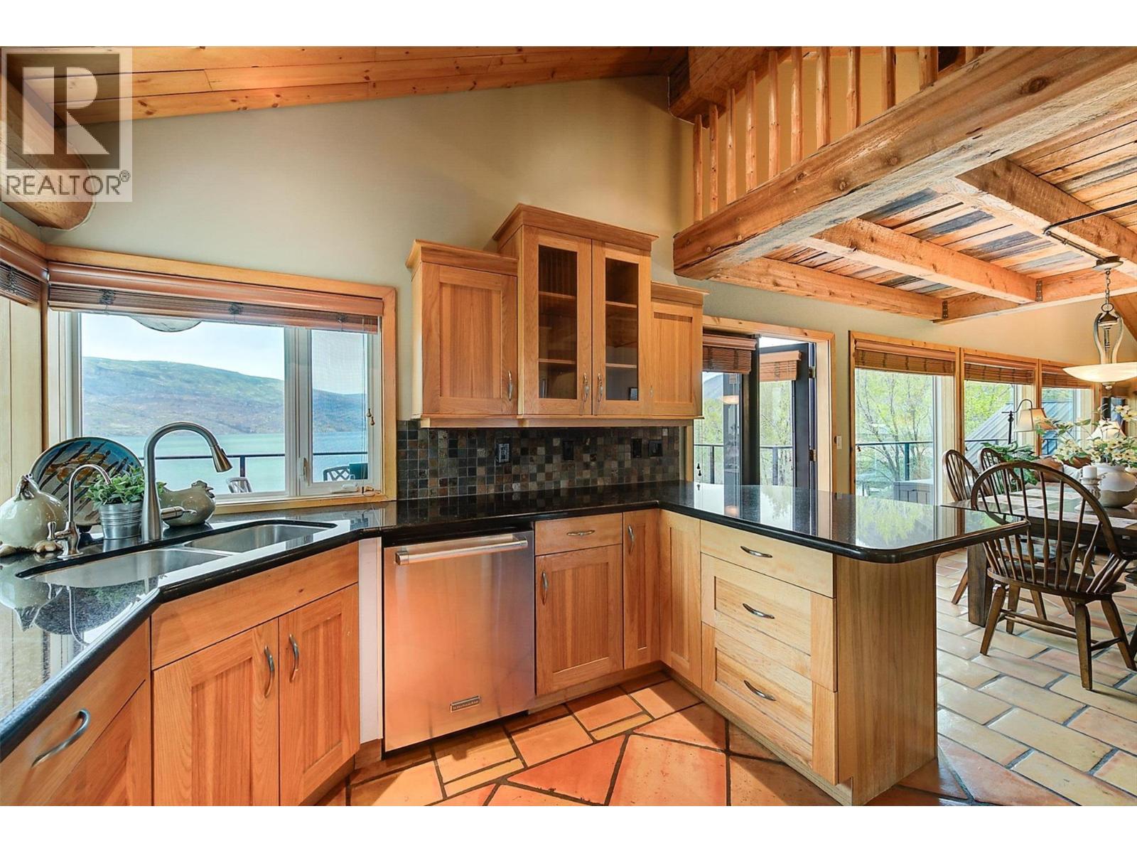 Maple wood cabinetry - 7172 Brent Road, Peachland, BC - Indoor Photo Showing Kitchen With Double Sink