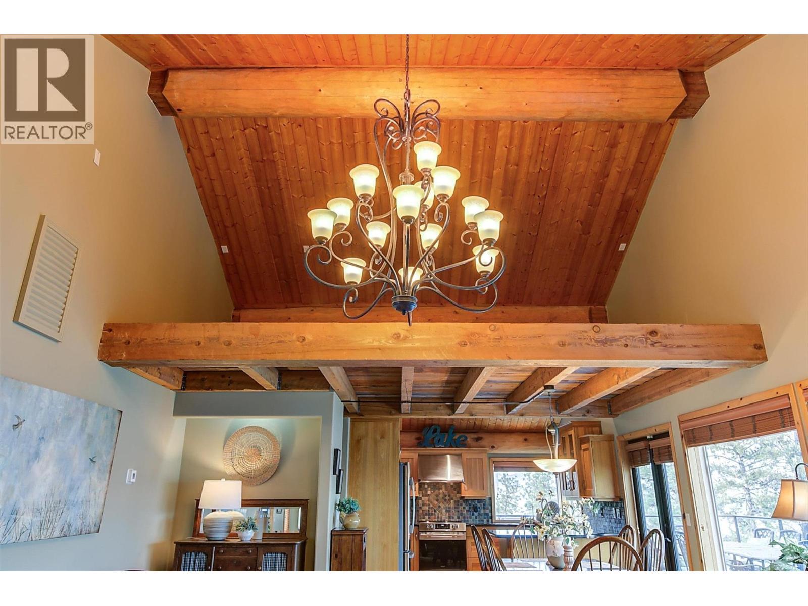 Vaulted ceiling with wood beam details and a loft above! - 7172 Brent Road, Peachland, BC - Indoor