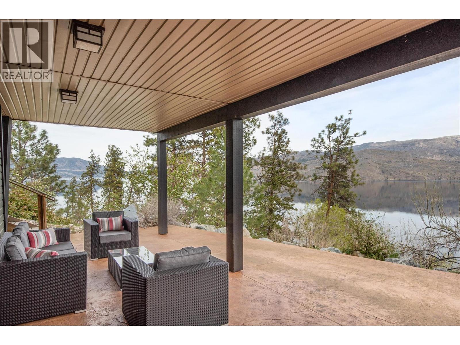 Stamped concrete patio - 7172 Brent Road, Peachland, BC - Outdoor With Deck Patio Veranda