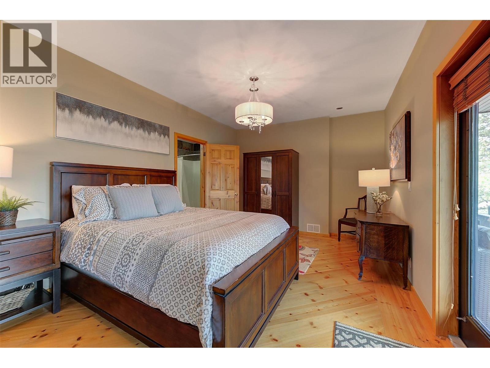2nd primary bedroom with ensuite bath - 7172 Brent Road, Peachland, BC - Indoor Photo Showing Bedroom