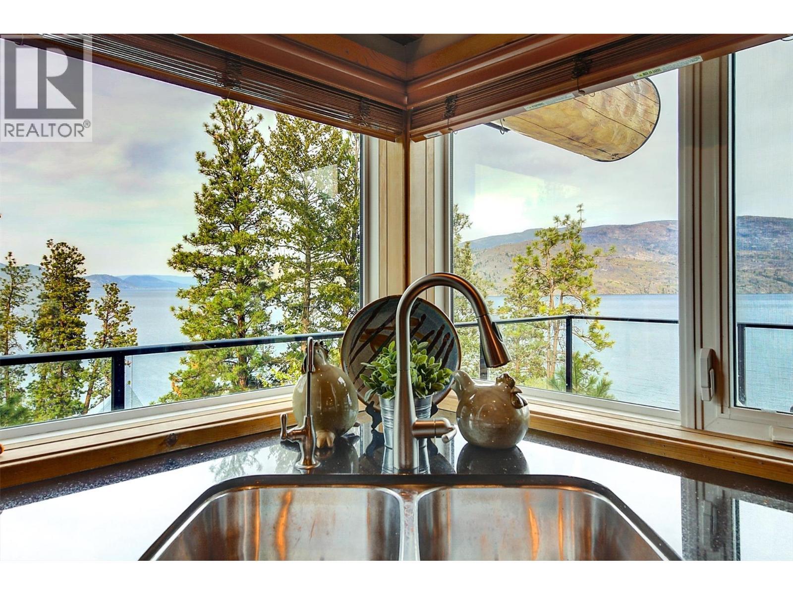 Look at that view from your kitchen sink! - 7172 Brent Road, Peachland, BC - With Body Of Water